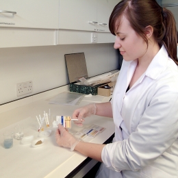 MA Textile Conservation student doing pH tests